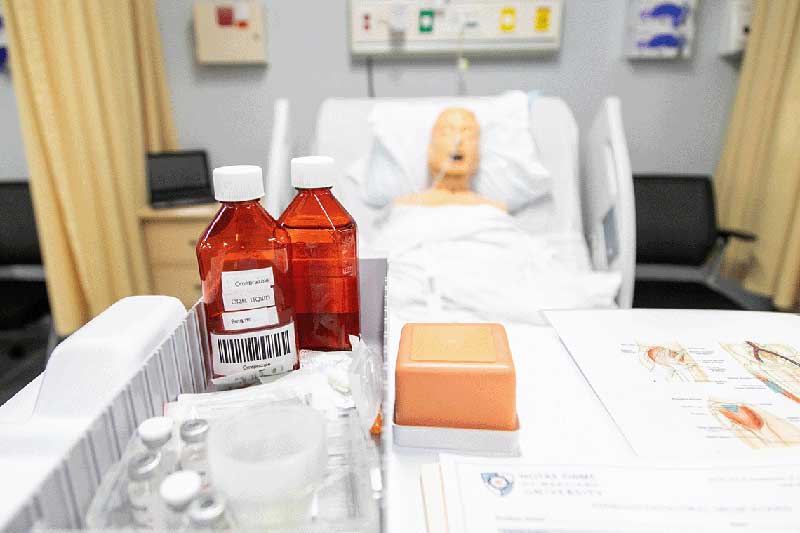 medicine and manikin in hospital setting
