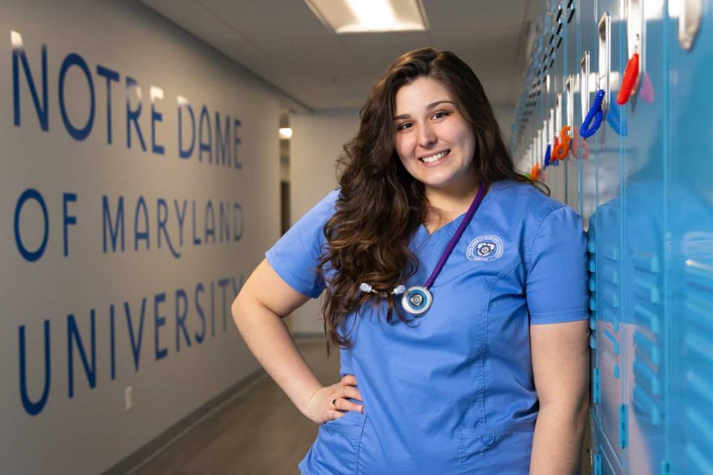 NDMU nursing student standing in hallway