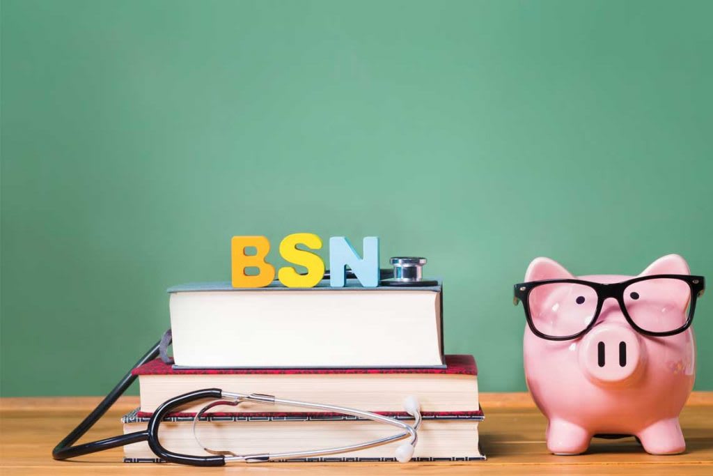 BSN letters on top of stack of books sitting next to a piggy bank