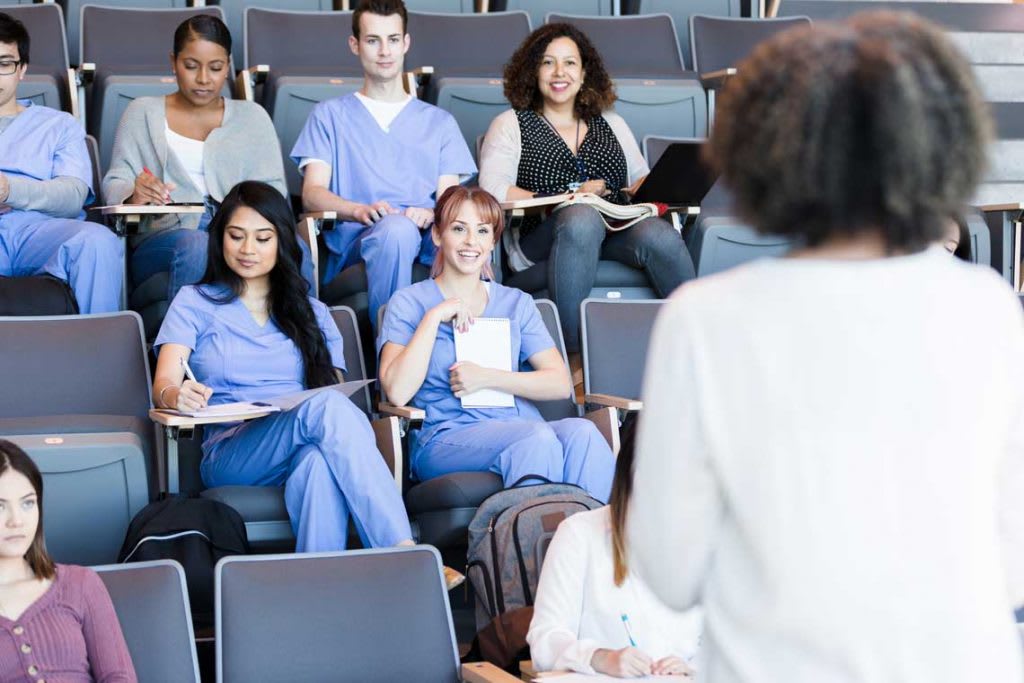 students in scrubs in class setting