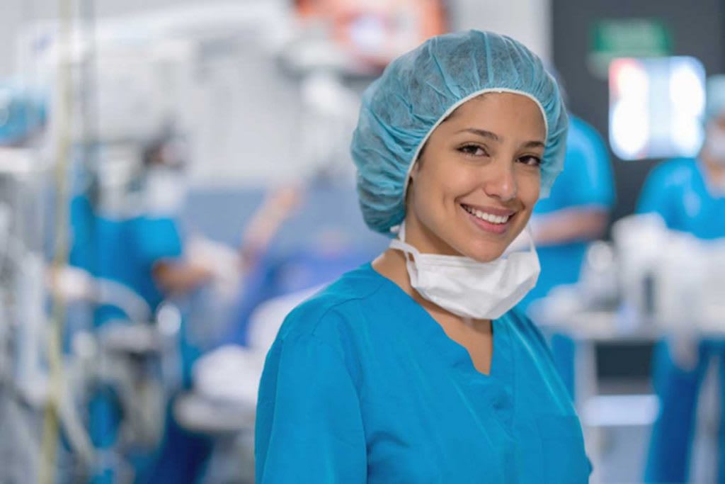 nurse portrait of nurse wearing scrubs and surgery garb