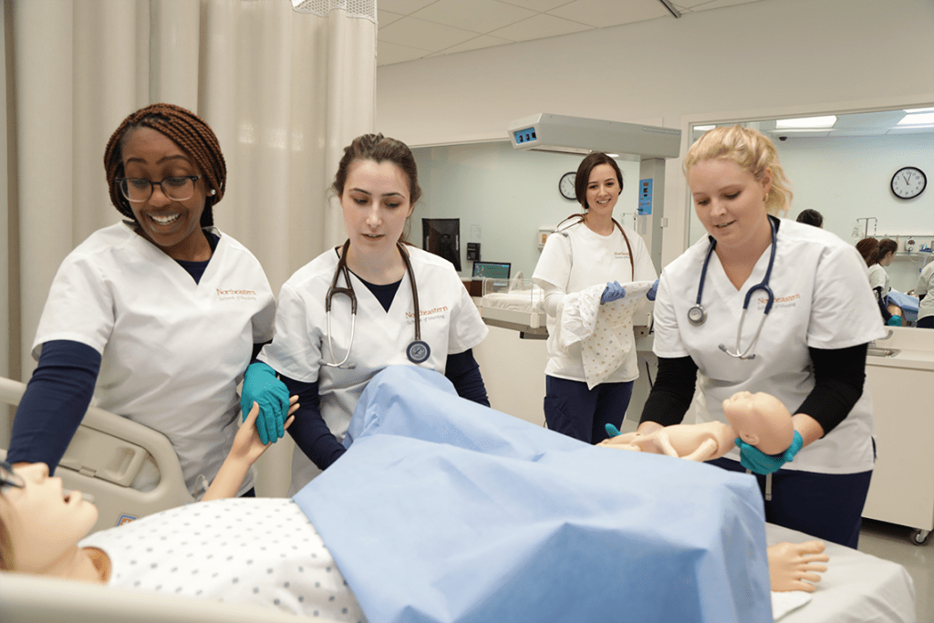 Northeastern nursing students working in sim lab