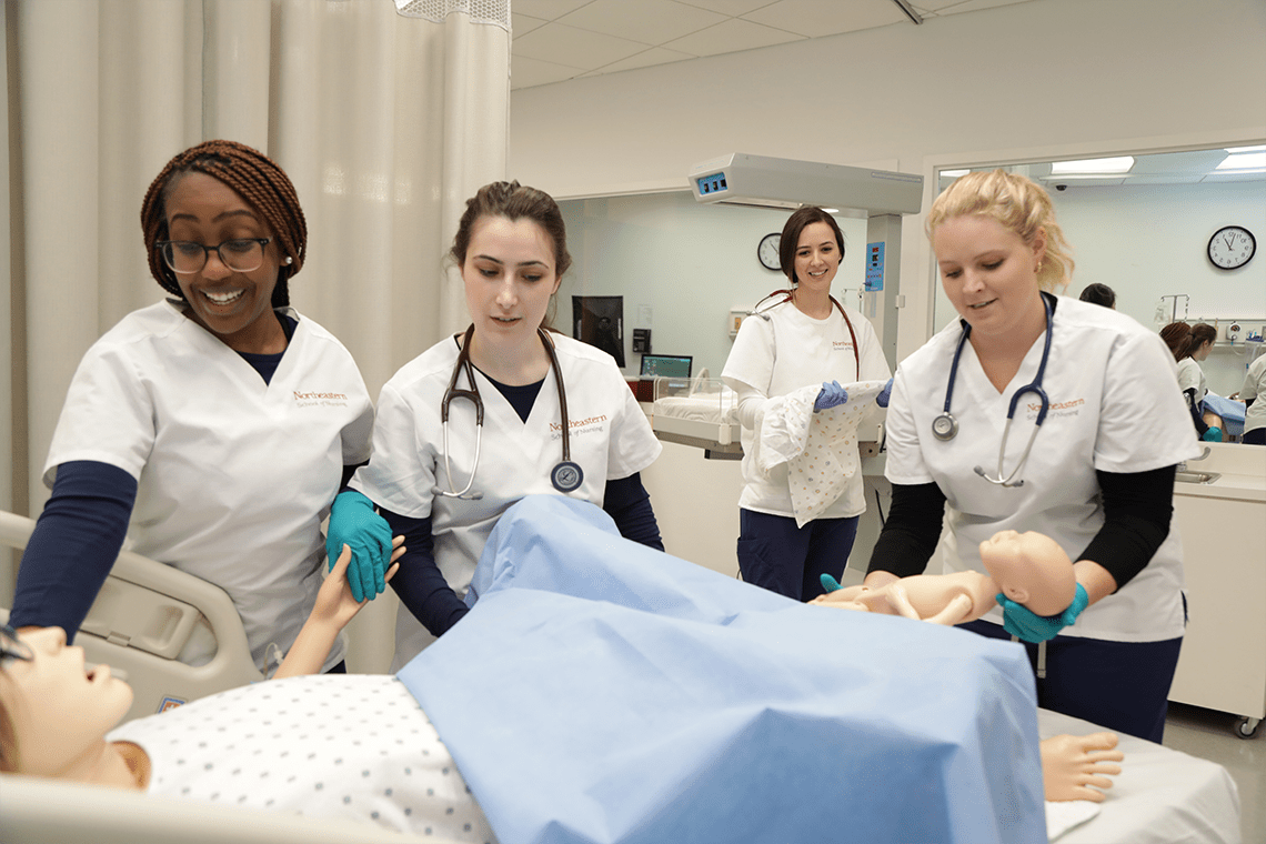 Northeastern nursing students working in sim lab