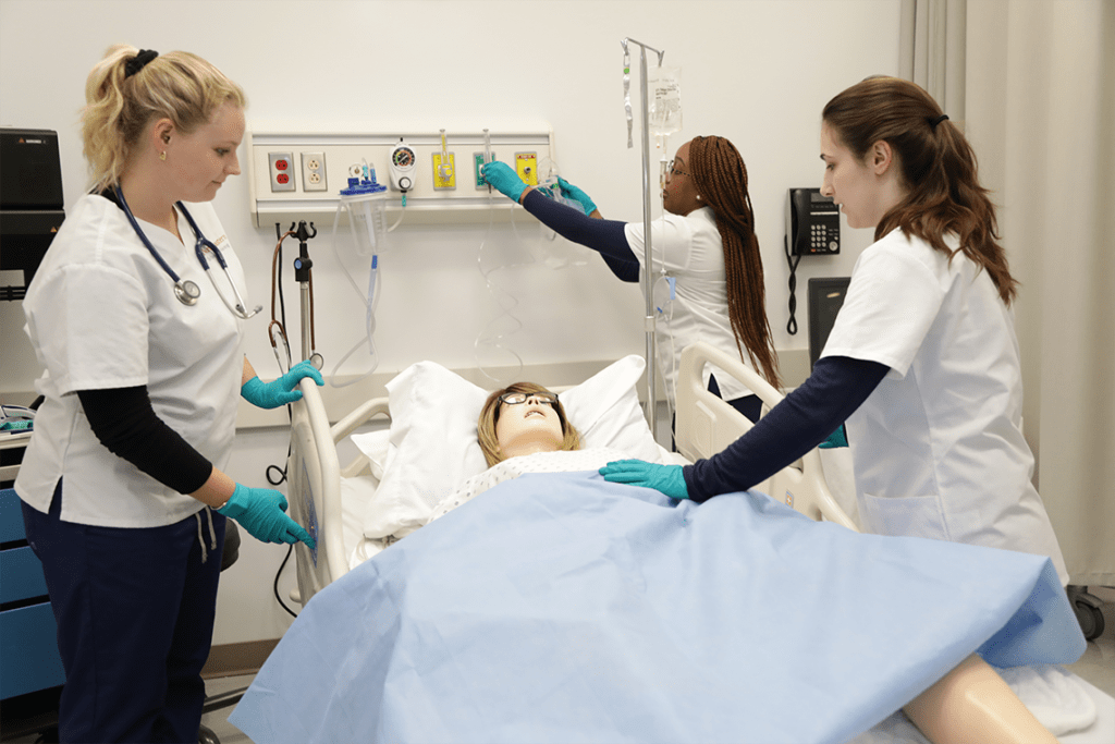 Northeastern nursing students working in sim lab