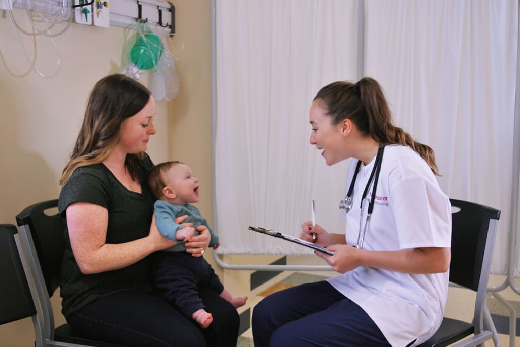 Northeastern ABSN student interacting with child patient