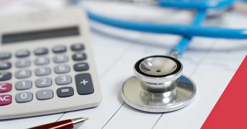 Closeup of stethoscope and calculator