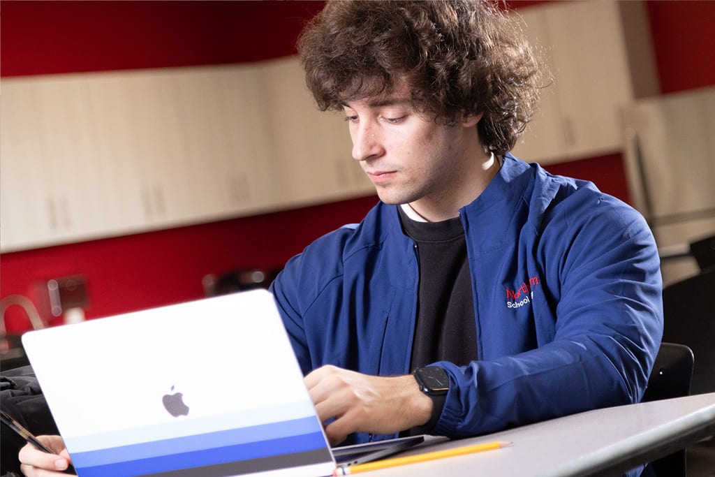 northeastern student studying on laptop