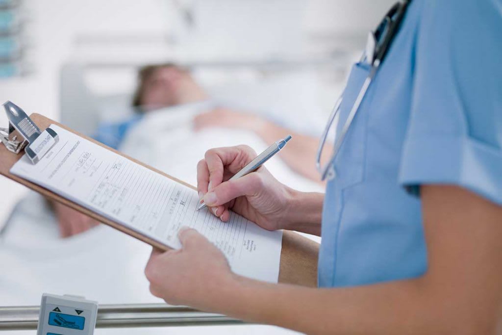 nurse holding a patient chart