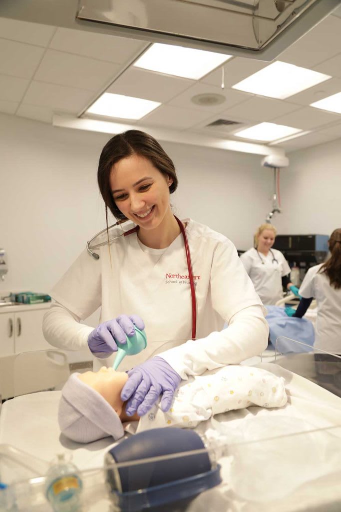 nursing student working in NICU sim lab