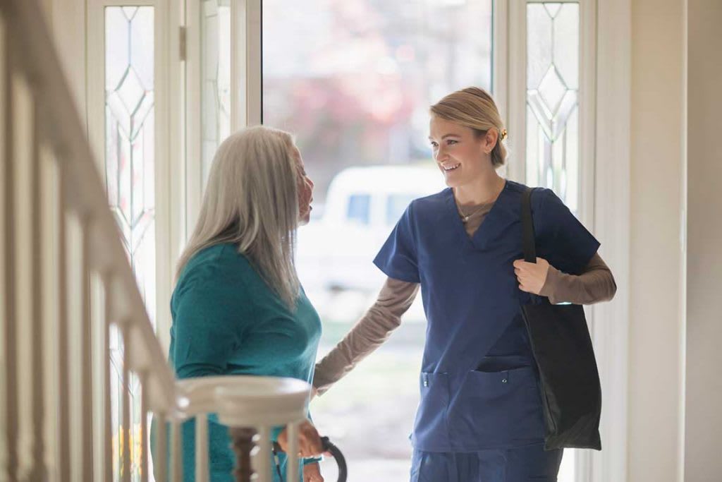 nurse walking into woman's home