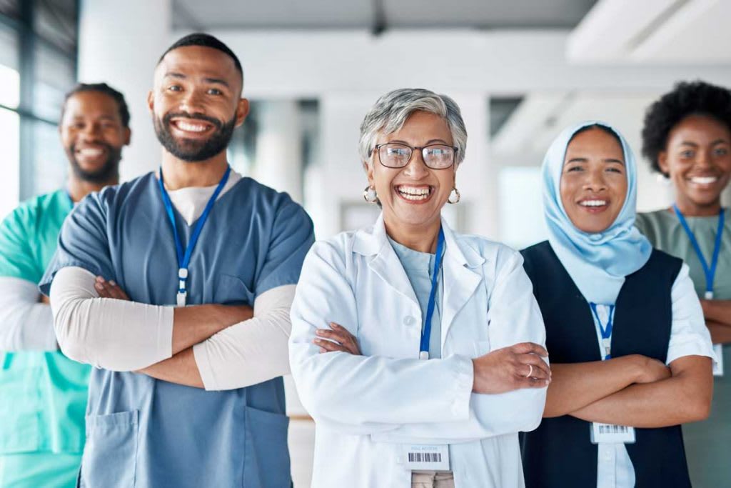 nurses and doctor standing side by side