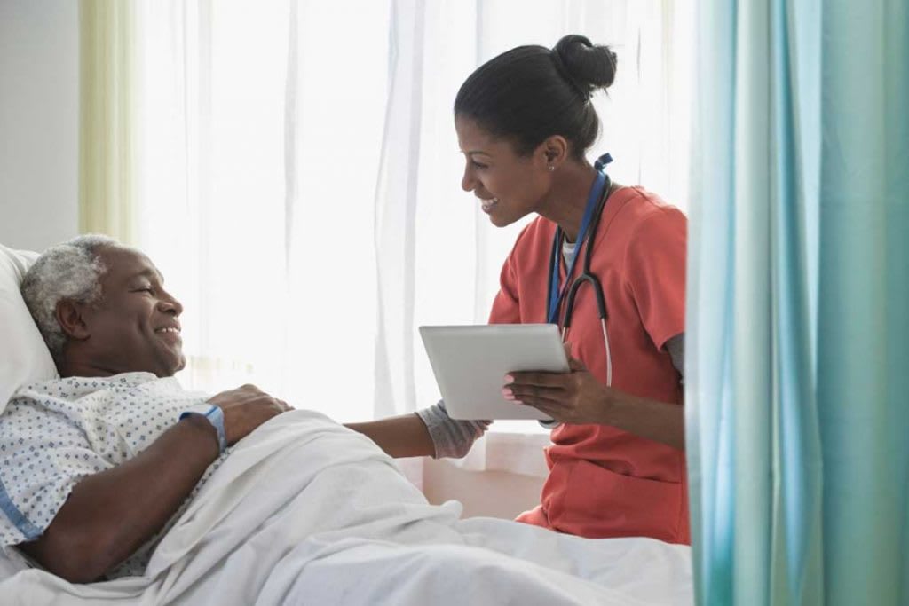 nurse talking with patient