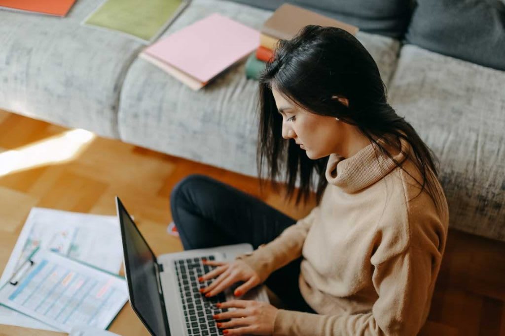 woman typing on laptop