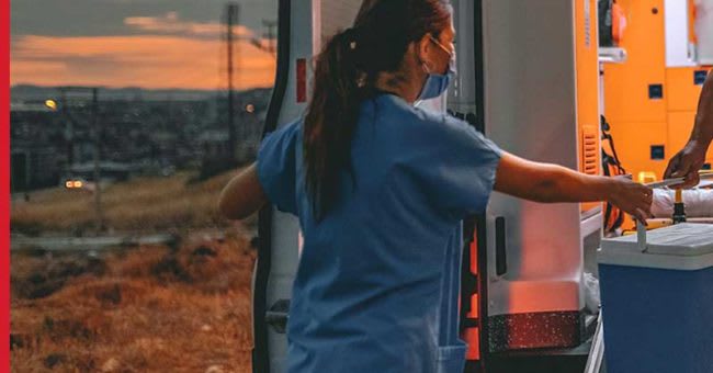 Disaster Relief nurse opening up back doors to medical vehicle