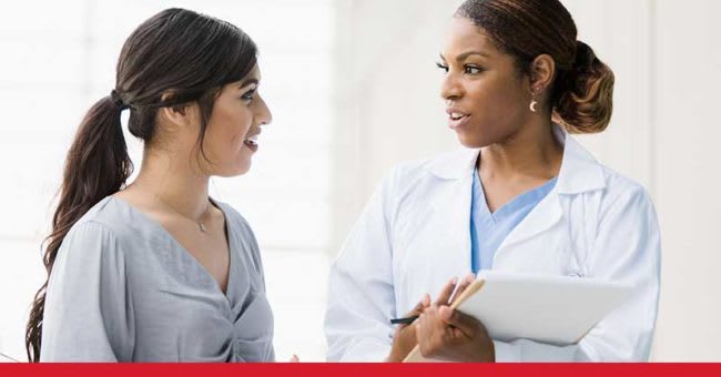 nurse speaking with her patient