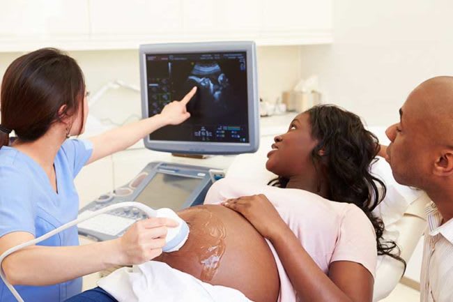 Maternity nurse performing an ultrasound