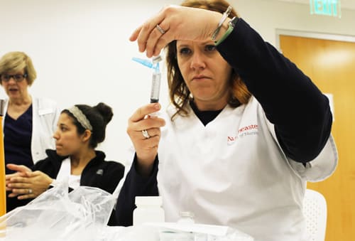 nursing student working in skills lab