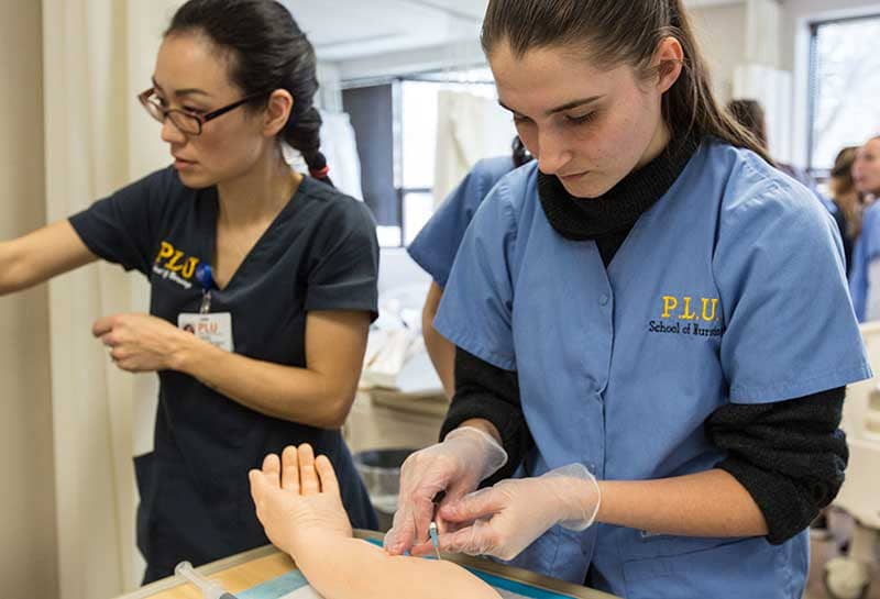 Pacific Lutheran University nursing students working in simulation lab