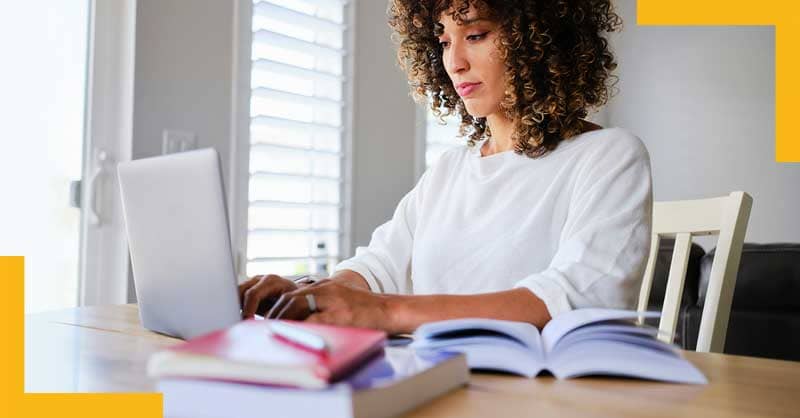 Woman at desk working on laptop