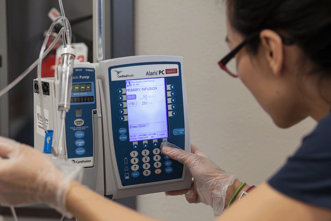 nursing student working with lab equipment