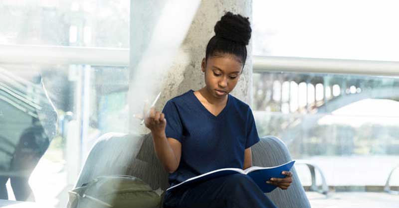 nursing student sitting and reading