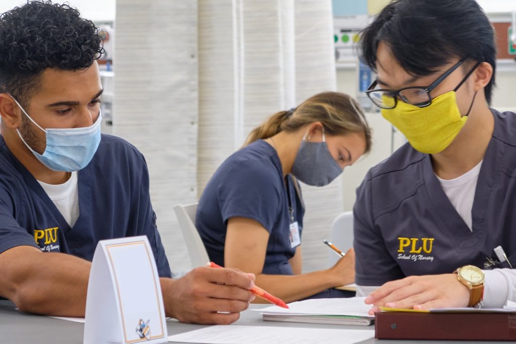 PLU ABSN students wearing masks and studying