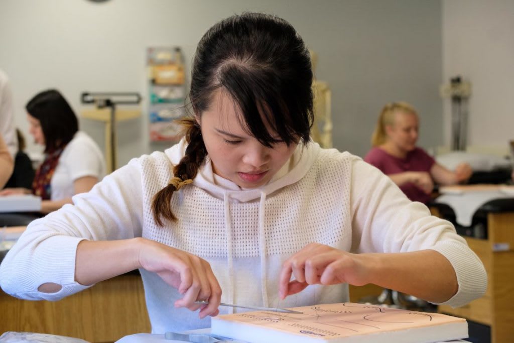 nursing student working in skills lab