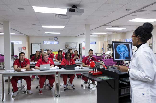 University of St. Thomas nursing students sitting at desks in class