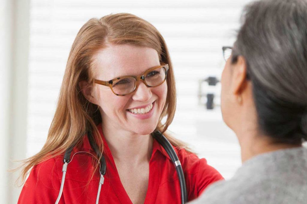 nurse smiling at patient