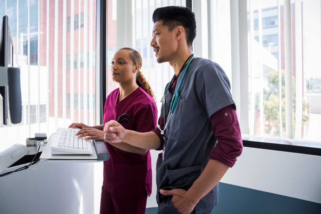 nursing students looking at computer