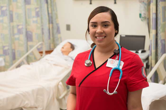 a UIW nursing student smiling at the camera