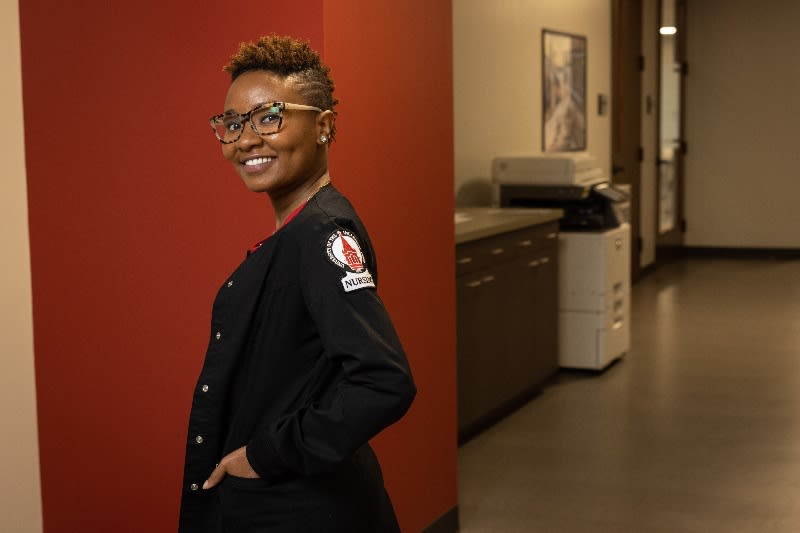 UIW nursing student in scrubs with UIW logo