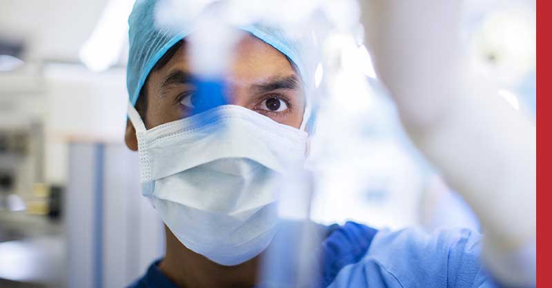 close up of a nurse with a mask on