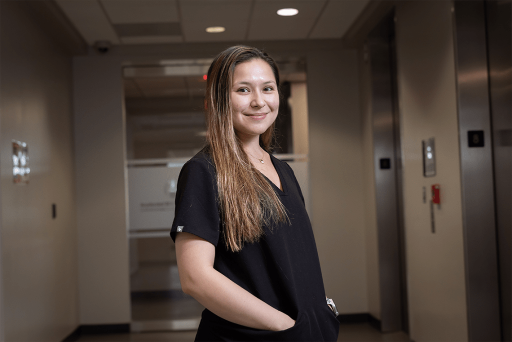 UIW nursing student smiling in black scrubs