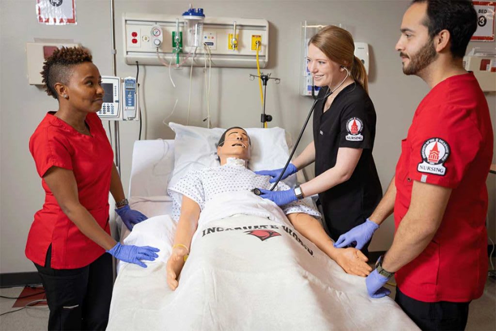 UIW nurses practicing on manikin