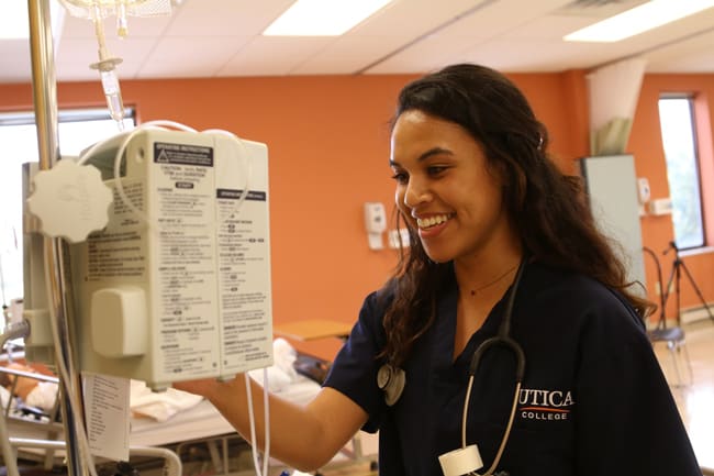 Utica nursing student with medical equipment