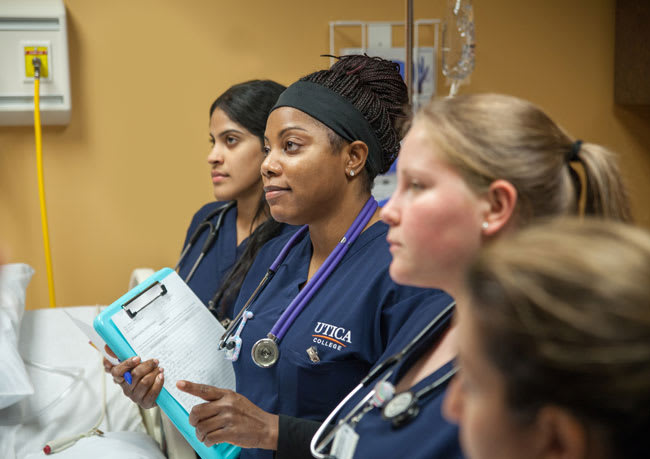 Utica nursing students in skills lab