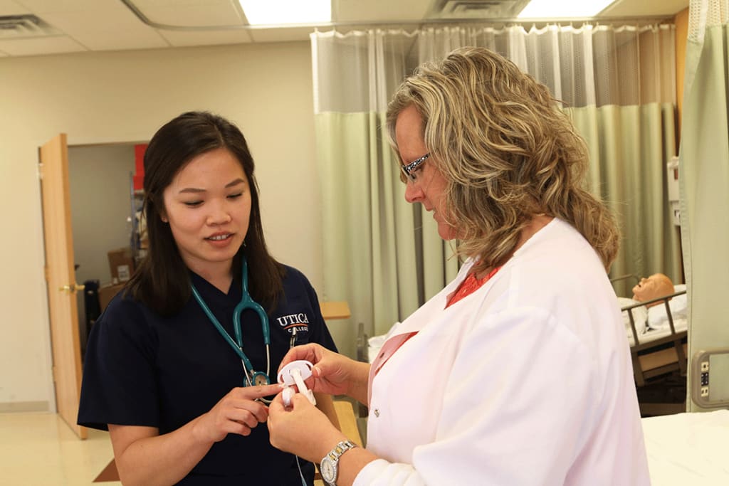 Utica student working with an instructor