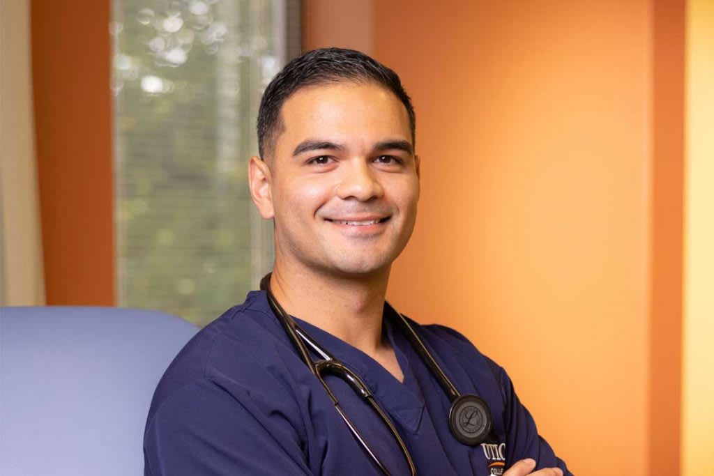 Utica nursing student standing and smiling