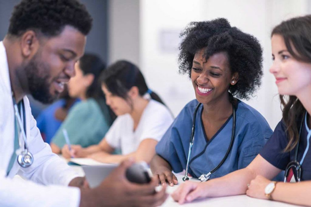 professor showing with nursing students in class