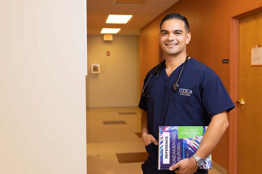 student nurse with book