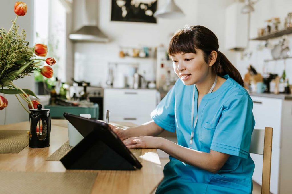 telehealth nurse using a tablet