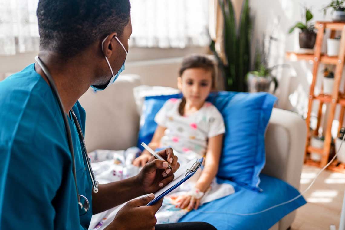 nurse taking notes while talking to child patient