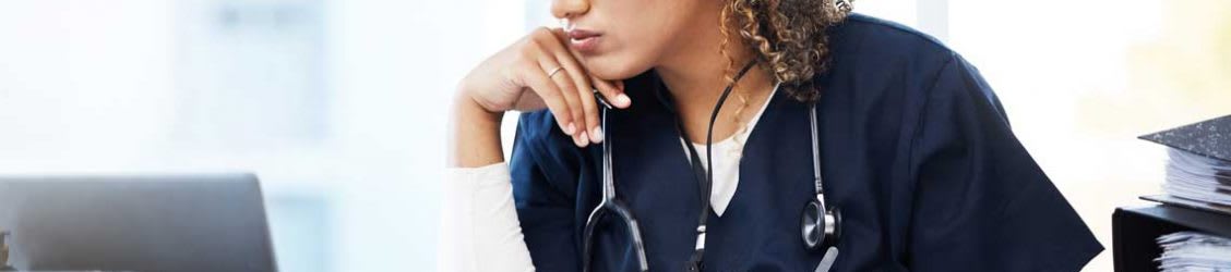 nurse looking at laptop