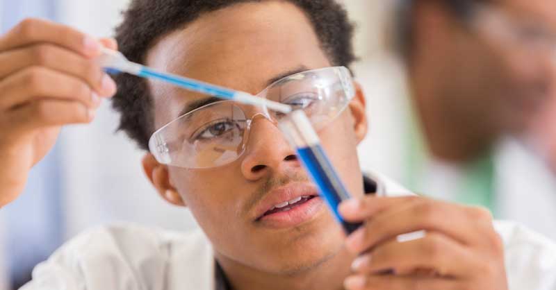 science student using test tubes