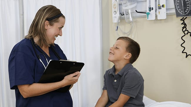 Nursing student with pediatric clinical patient