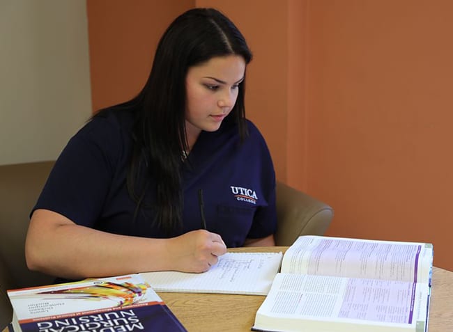 Utica ABSN student studying