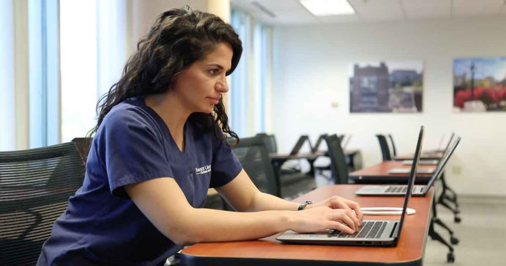 nursing student using laptop
