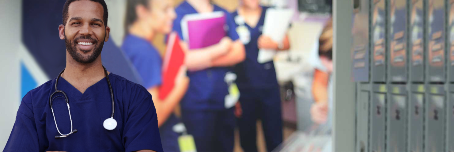 Nursing student smiling in front of Xavier ABSN site wall