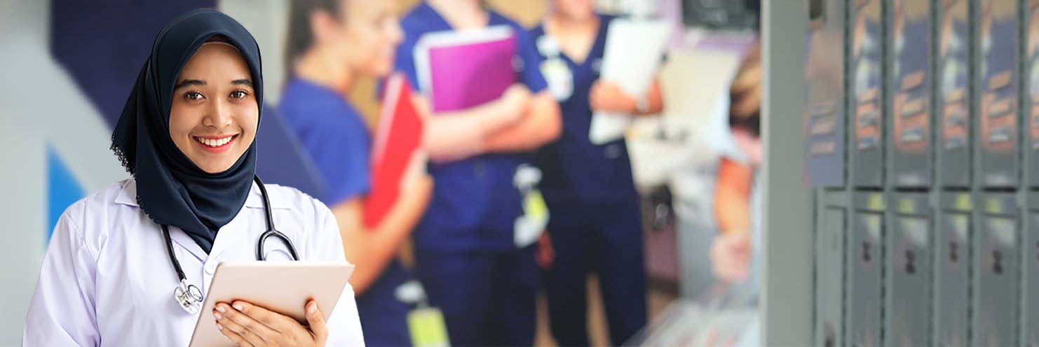 Nursing student with ipad in the halls of Xavier's ABSN Learning Site